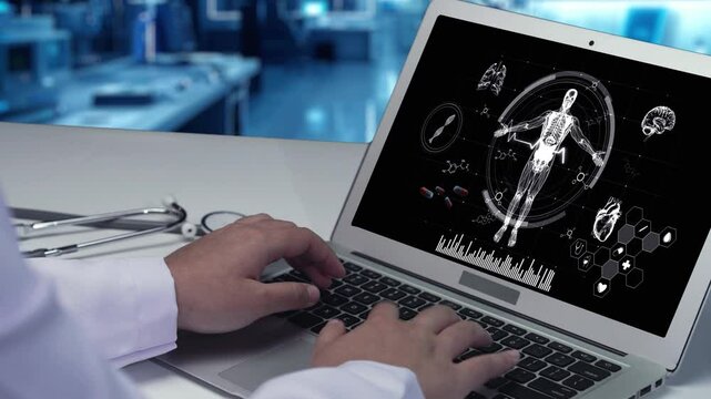 Close up of smart doctor working and looking at laptop with human anatomy hologram screen at laboratory. Professional medical worker accessing medical data while diagnosis from human x ray. Remedial.