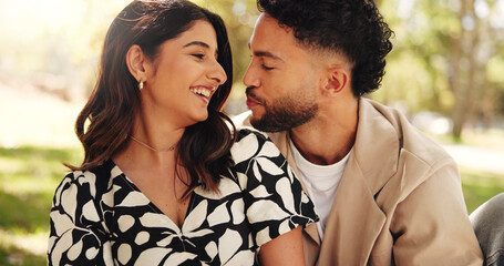 Outdoor, bonding and couple on date, picnic and joke for conversation in nature, smile or...