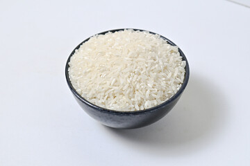 Close up view of Rice in black bowl, isolated on white background, clipping path, full depth of field, ingredients, calories.