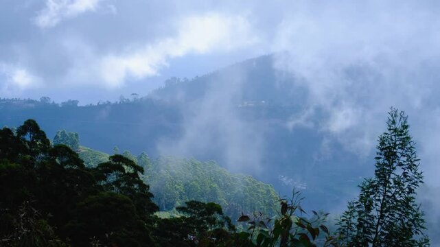 Fast moving rising clouds in mountainous rural countryside area of Haputale in highlands of Sri Lanka