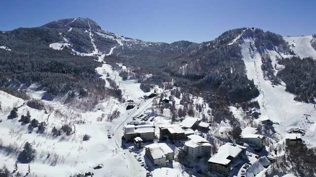 Drone shot of hotels and Yokoteyama ski resort in Shiga Kogen, Nagano, Japan