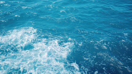 Fototapeta premium Ocean waves, blue water surface, top view
