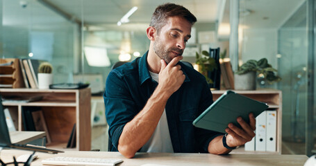 Tablet, thinking and reading with business man in office for planning, ui designer and app review....
