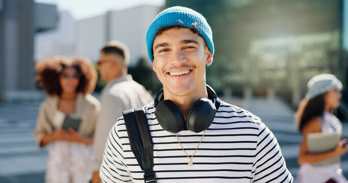 Headphones, student and portrait of happy man in city for travel to university, college and school campus. Smile, relax and person with backpack in urban town for education, learning and knowledge