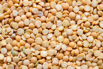 Close-up of dried pea groats. The texture of dry raw peas.