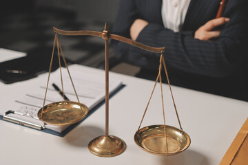 Judge gavel with Justice lawyers having team meeting at law firm background. Concepts of Law and...