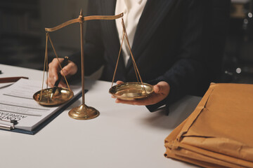 Judge gavel with Justice lawyers having team meeting at law firm background. Concepts of Law and...