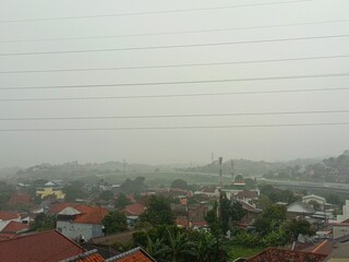 Obraz premium dark cloudy landscape seen from above in the city. Semarang. 19032025