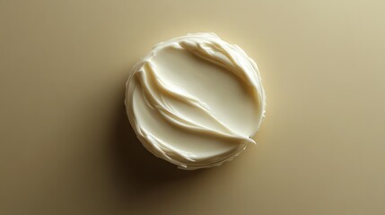 A delicate sample of creamy, white cosmetic cream, its smooth texture promising a touch of radiance.