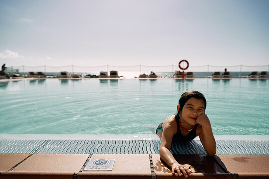 girl in outdoor swimming pool at hotel