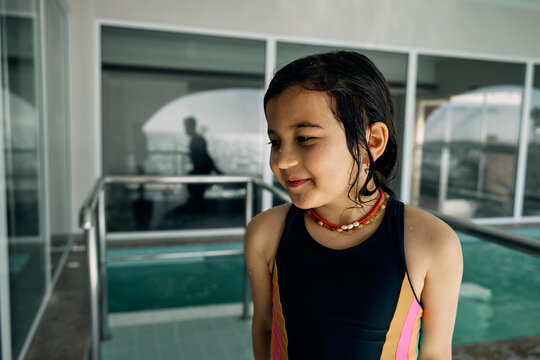 father and daughter in indoor swimming pool