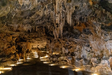 Cave setting with rocks and light display rock formations