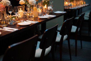 Elegant Dining Table Setup with Candles and Flowers