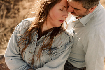 Fototapeta premium A couple shares an intimate moment with eyes closed
