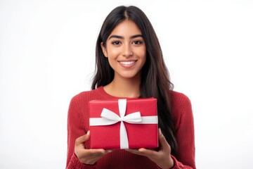 portrait of a happy hispanic woman holding a red present with a white ribbon