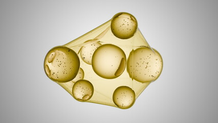 cluster of golden oil bubbles floats above a light gray background, suspended within a thin,...