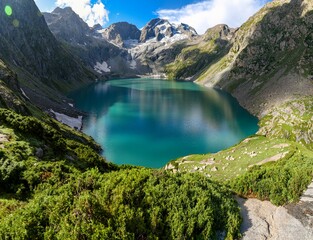Katora Lake, nestled in the upper reaches of Kumrat Valley, Pakistan, boasts stunning blue waters surrounded by snow-capped peaks. Its bowl-shaped form, fed by melting glaciers, gives amazing view. © Faizan