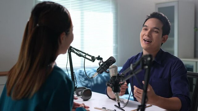 Podcasters discussing during recording session