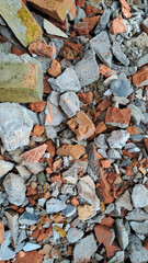 Pile of broken red bricks and fragments of concrete from destroyed building	
