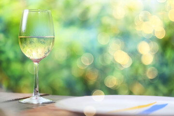 A glass of white wine on a blurred abstract background, alcohol, relaxation