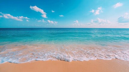 Soft waves lap a pristine beach under a vibrant blue sky. Paradise found!