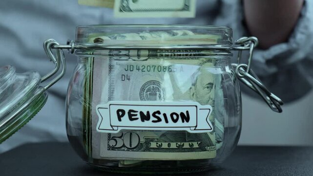 Takes money out of a jar labeled Pension.