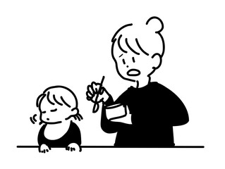 離乳食を食べない子供と母親