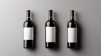Elegant Red Wine Bottles with Blank Labels on a Neutral Background