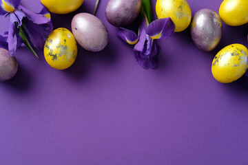 Happy Easter banner design. Flat lay composition with vibrant yellow and purple eggs, golden...
