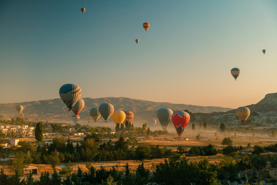 Hot Air Balloon at Sunrise in Cappadocia with Dusty Golden Glow