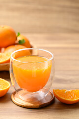 Glass of orange juice and fresh orange fruit on wooden background, Healthy drink