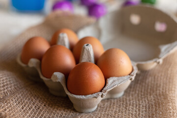 Chicken eggs in an egg carton. Homemade chicken eggs close-up. Easter eggs
