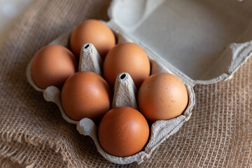 Chicken eggs in an egg carton. Homemade chicken eggs close-up. Easter eggs