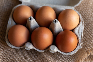 Chicken eggs in an egg carton. Homemade chicken eggs close-up. Easter eggs