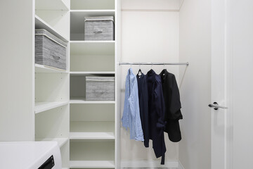 Wardrobe with shelves in the dressing room