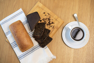 Top view of coffee cup and bread on the table