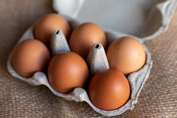 Chicken eggs in an egg carton. Homemade chicken eggs close-up. Easter eggs