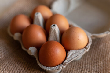 Chicken eggs in an egg carton. Homemade chicken eggs close-up. Easter eggs
