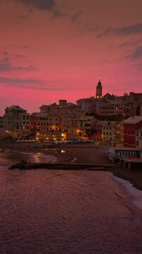 A close-up view of the picturesque village of Bogliasco at sunset. The warm light highlights the traditional Ligurian architecture, creating an intimate and charming atmosphere