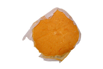isolated transparent Background. golden sponge cake wrapped in white paper, showcasing its soft and fluffy texture
