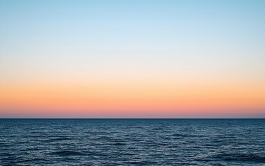 Fototapeta premium Colorful sunset over calm ocean waters, capturing tranquil moments and serene beauty after a long day by the coast