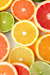 Obraz premium Vibrant assortment of sliced citrus fruits