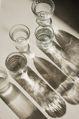 Earthy Warm Tones with Glass Cups, Light and Shadow Interplay