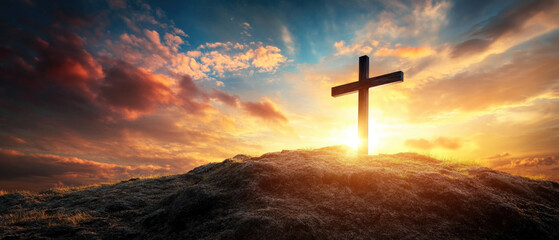 Dramatic calvary cross silhouette against a vibrant sunset backdrop
