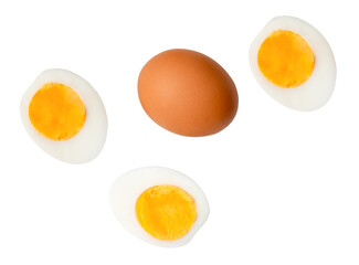 Top view set of raw brown chicken egg and cooked or boiled chicken eggs with egg yolk in three halves isolated with clipping path in png file format