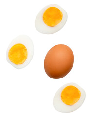 Top view set of raw brown chicken egg and cooked or boiled chicken eggs with egg yolk in three halves isolated with clipping path in png file format