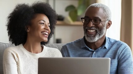 Online Together Joyful Senior Couple Enjoys Shared Online Shopping Experience at Home.