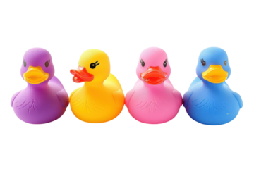Colorful rubber ducks lined up, showcasing bright hues in playful arrangement on a clean white surface