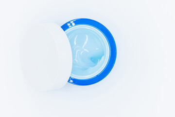Top view blue water gel cosmetic serum in blue container, Liquid gel moisturizer, Blue gel serum texture make up and cosmetic texture background, skincare product and beauty cream..
