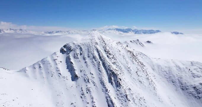 Aerial view of Snow mountain of Jiajinshan in Sichuan China with clouds and mist, amazing nature landscape